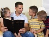 Father reading to his children
