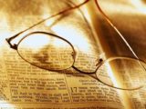 Glasses on Open Bible